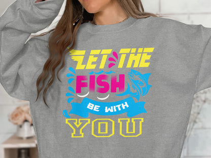 Gray sweatshirt with "LET THE FISH BE WITH YOU" text and fish graphics.