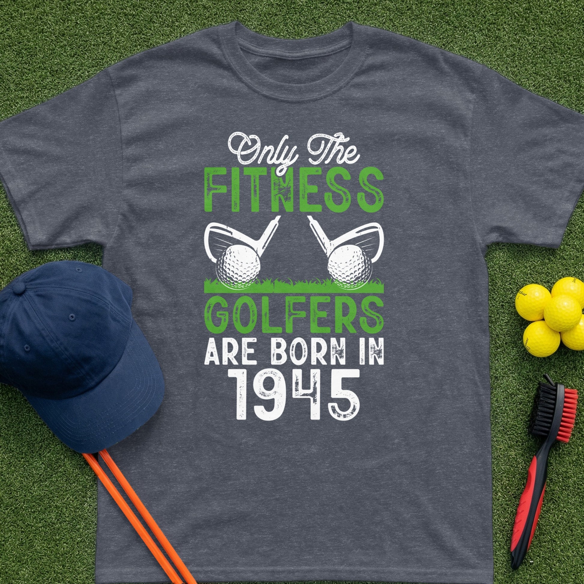 Dark grey t-shirt with text "Only The Fitness Golfers Are Born In 1945" and golf imagery.
