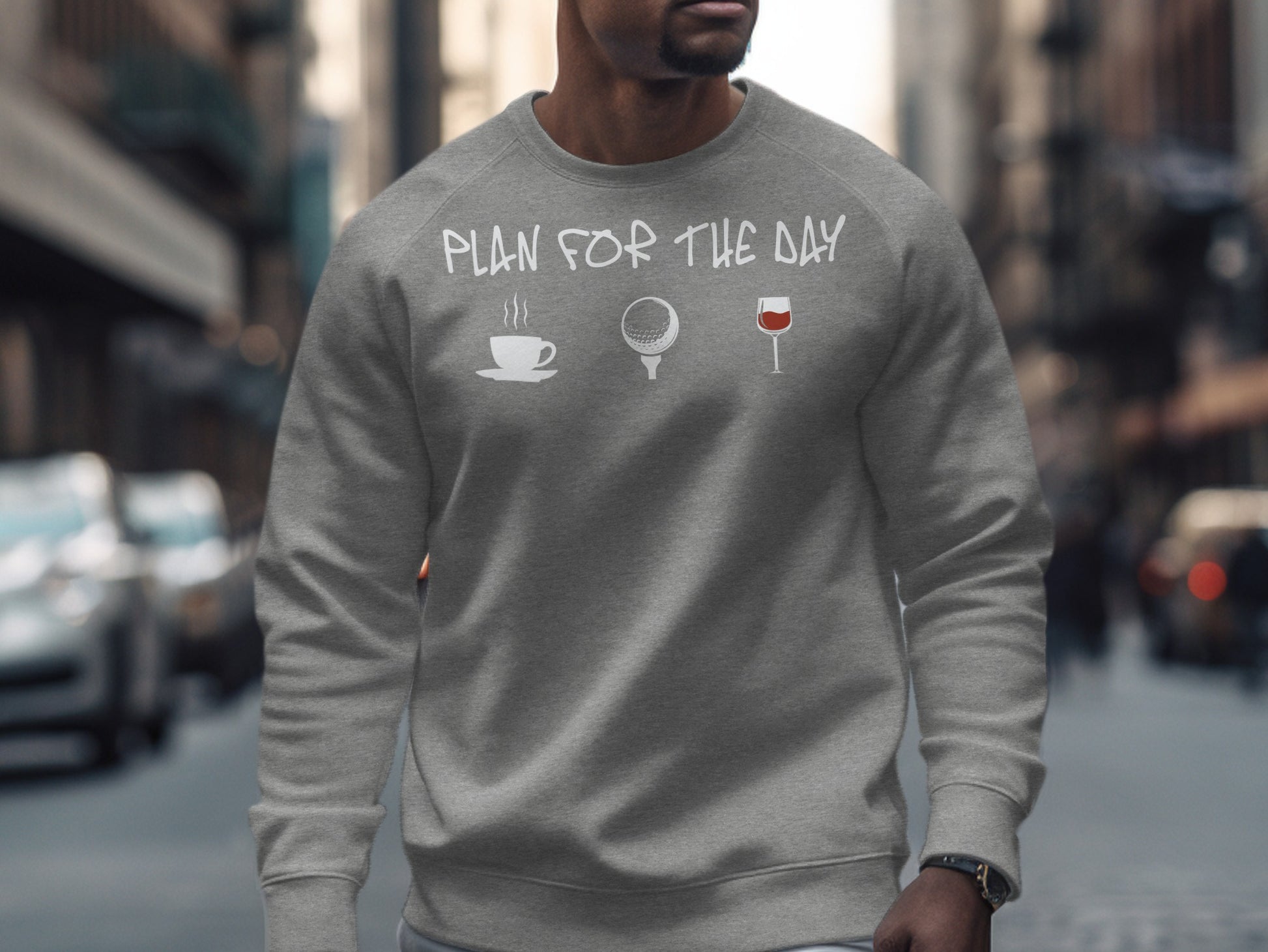 Gray sweatshirt with coffee, golf, and wine glass icons and text "Plan for the Day".