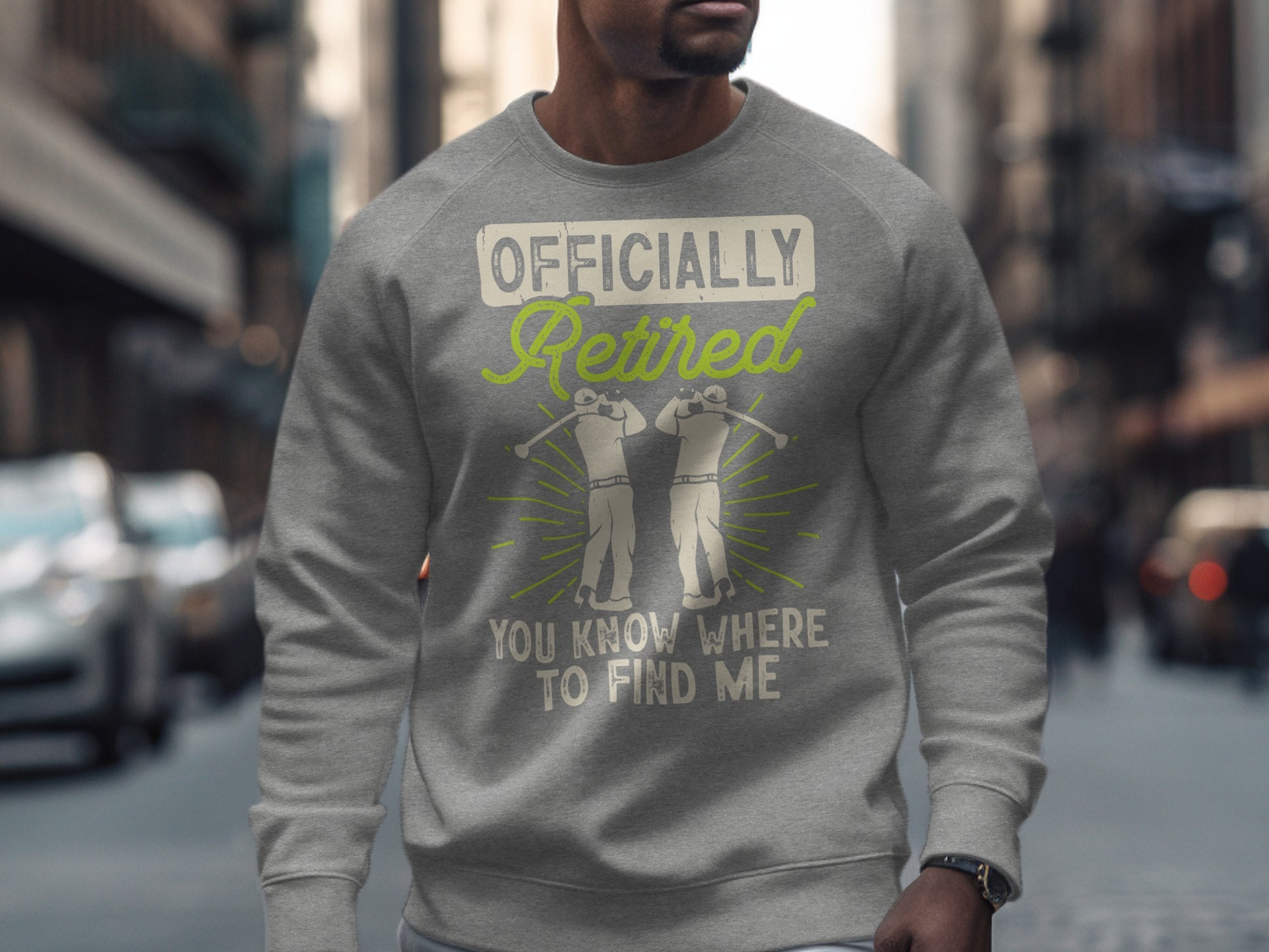 Gray sweatshirt with "Officially Retired You Know Where To Find Me" text and golf graphic.