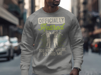 Gray sweatshirt with "Officially Retired You Know Where To Find Me" text and golf graphic.