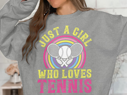 Gray sweatshirt with "Just a girl who loves tennis" and crossed rackets and rainbow.