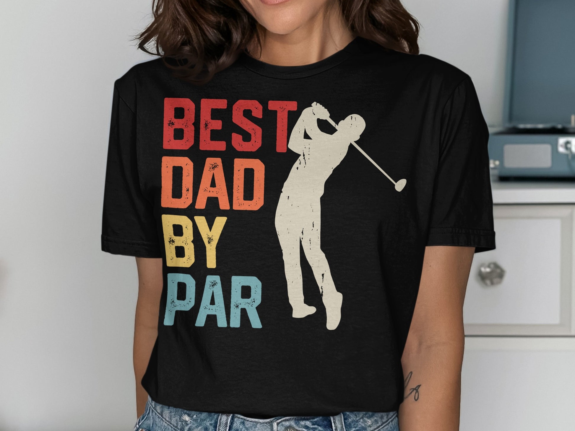 BEST DAD BY PAR text with golfer silhouette on a t-shirt.