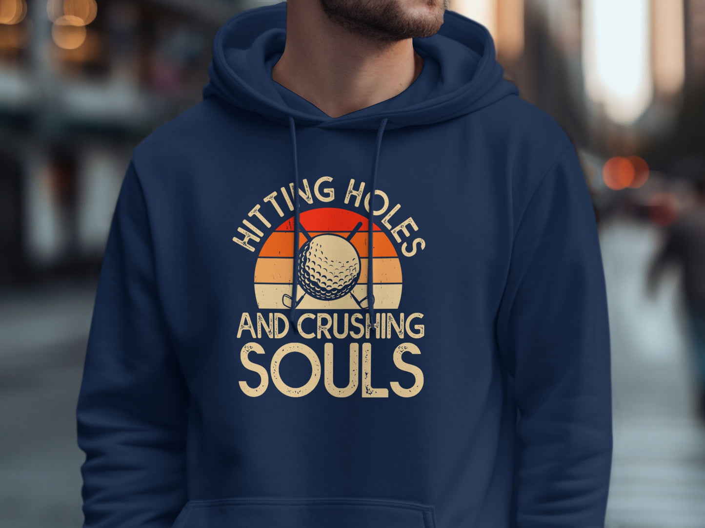 Navy hoodie with "Hitting Holes And Crushing Souls" text and golf ball design.