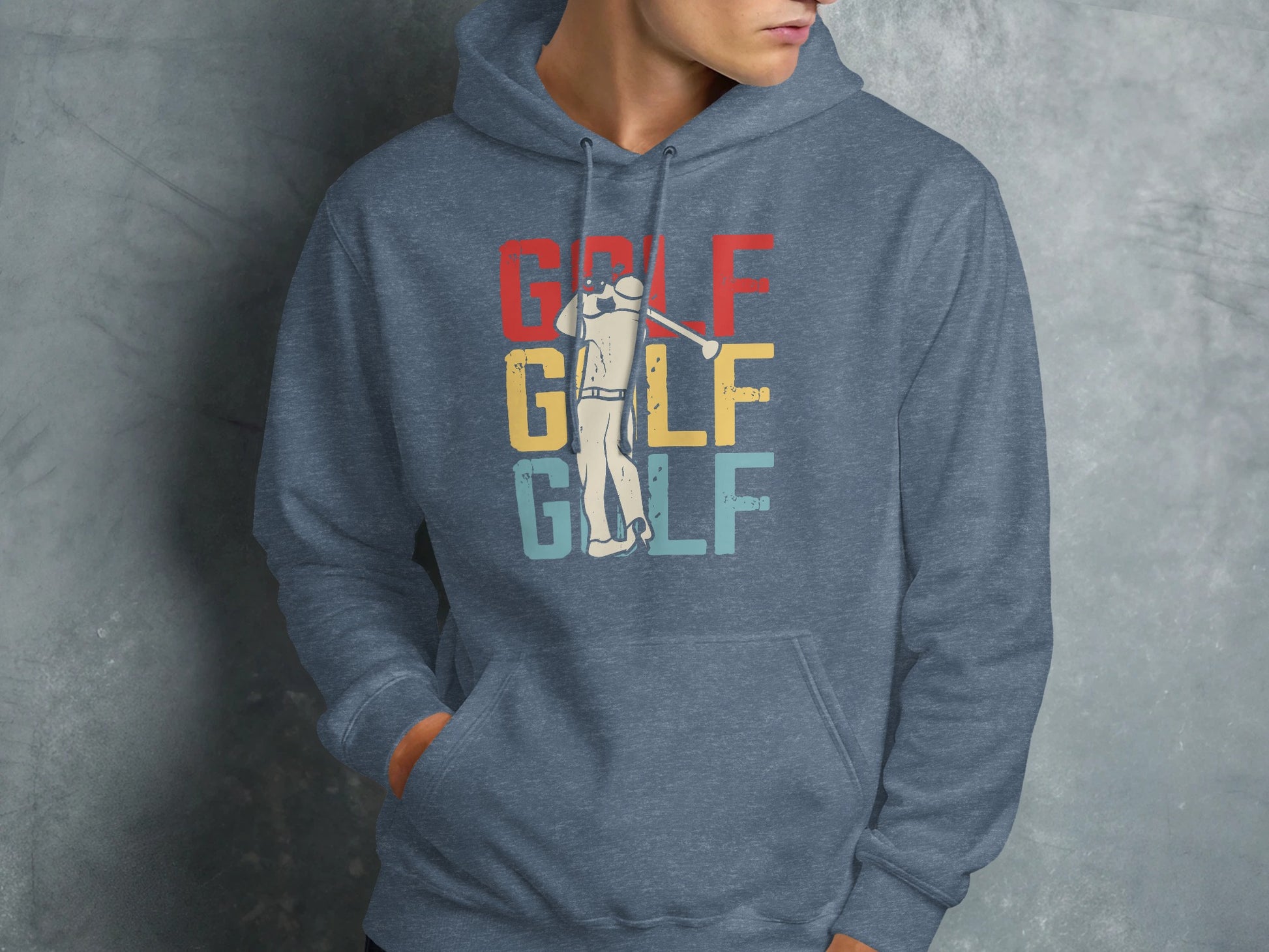 Man wearing a blue hoodie with distressed golf graphic.