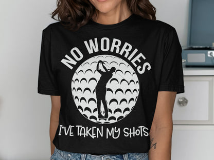 Black t-shirt with golfer silhouette, golf ball pattern, and text "NO WORRIES I'VE TAKEN MY SHOTS".