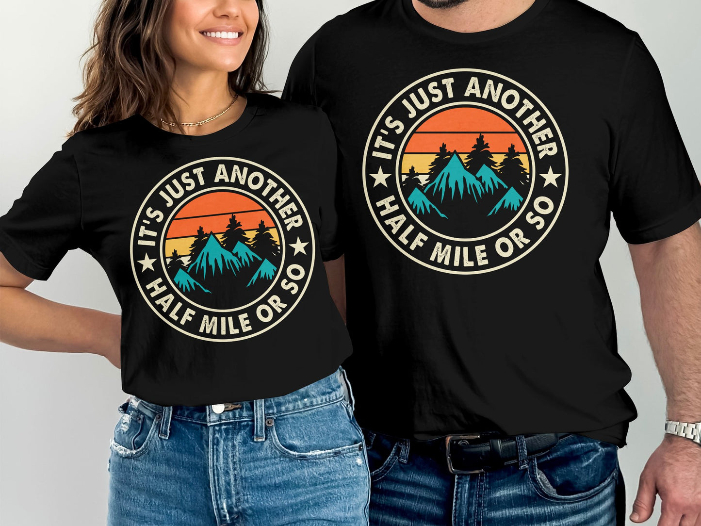 Circular emblem with mountains, trees, and text "It's Just Another Half Mile or So."
