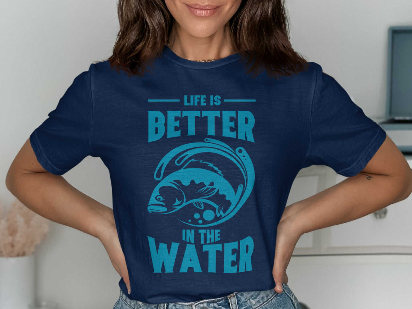Navy t-shirt with "LIFE IS BETTER IN THE WATER" and a stylized fish graphic.