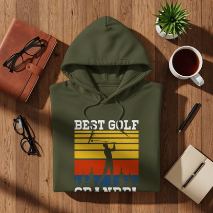 Green hooded sweatshirt with "BEST GOLF GRANDPA" text and sunset golf graphic.