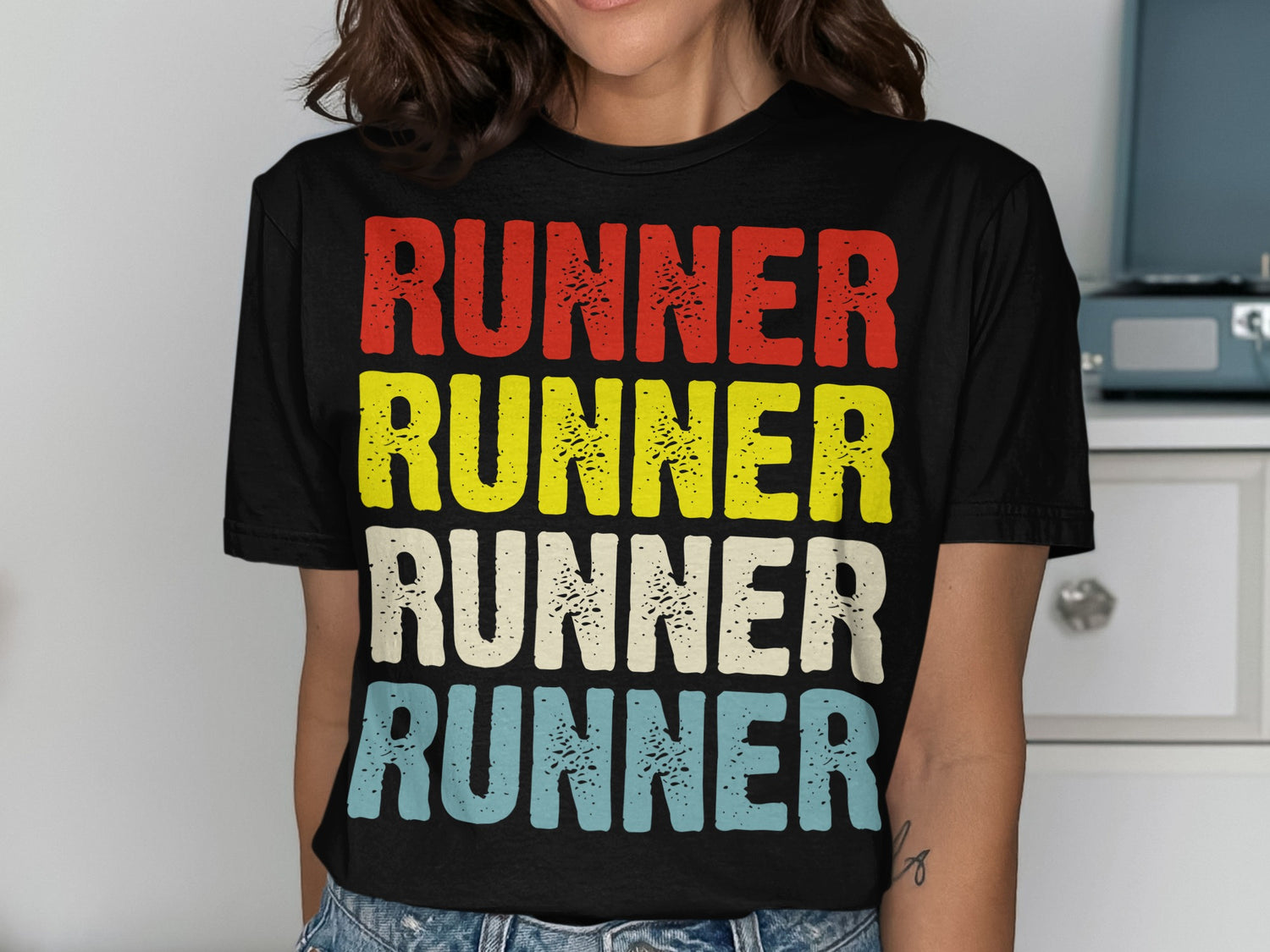 Black t-shirt with "RUNNER" printed four times in red, yellow, white, and blue.