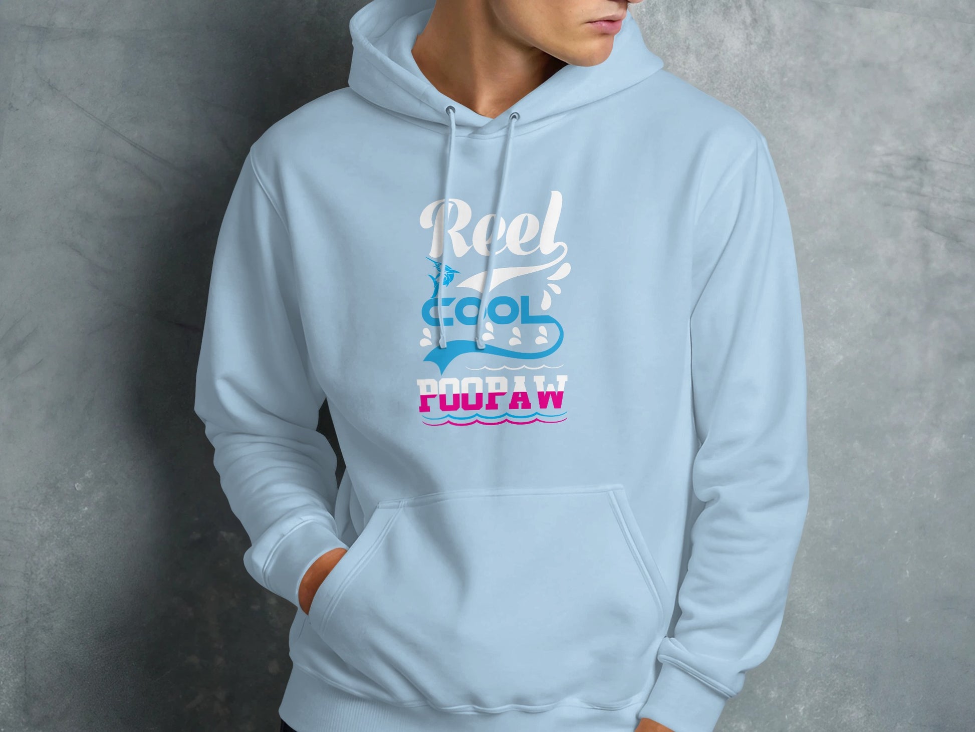 Light blue hoodie with "Reel Cool Poopaw" graphic in white and pink.
