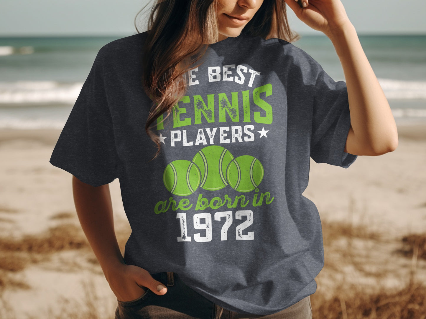 Dark t-shirt with "The best tennis players are born in 1972" and tennis balls.