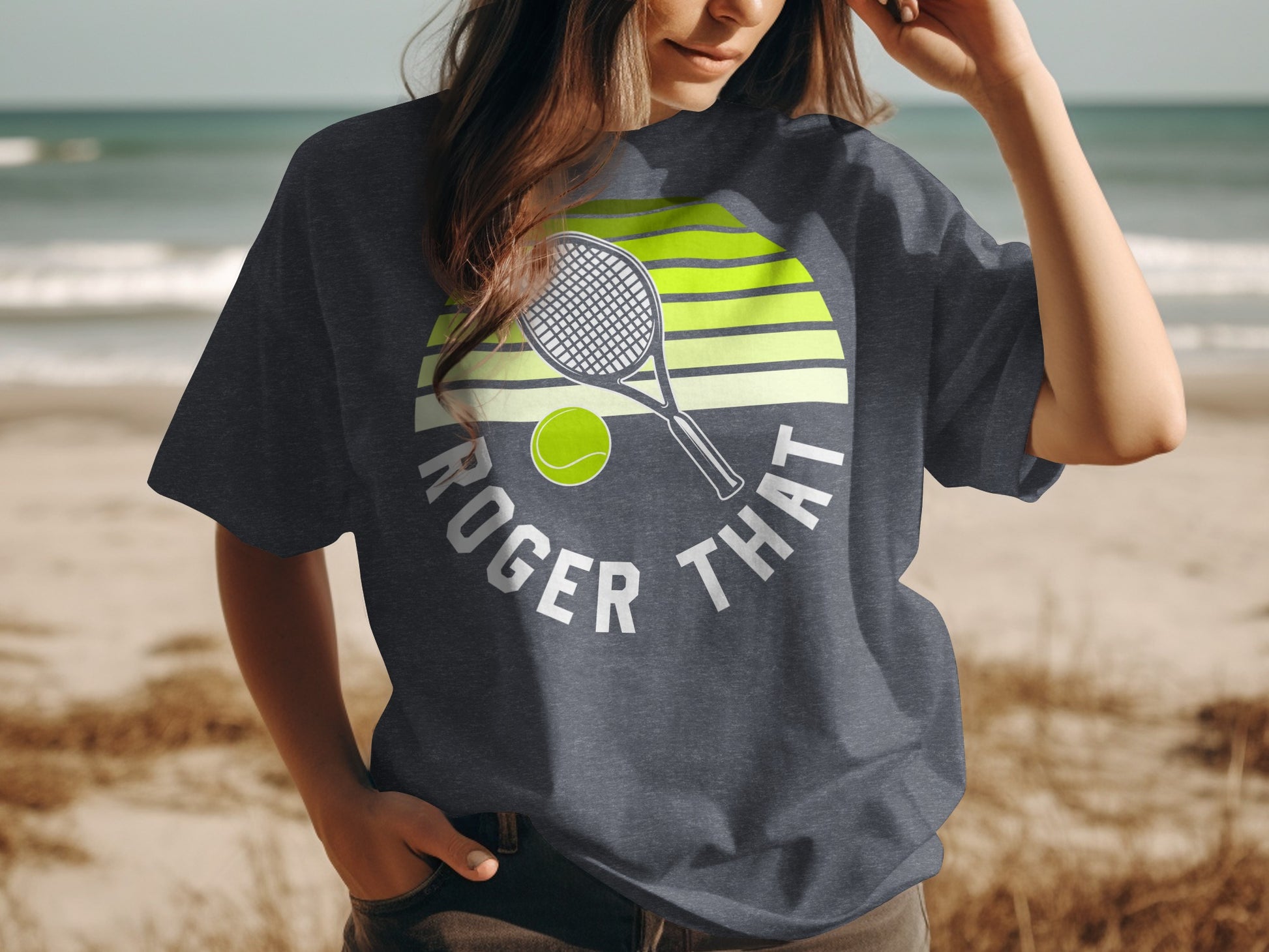 Dark t-shirt with "Roger That" text, tennis racket, ball, and sun graphic.