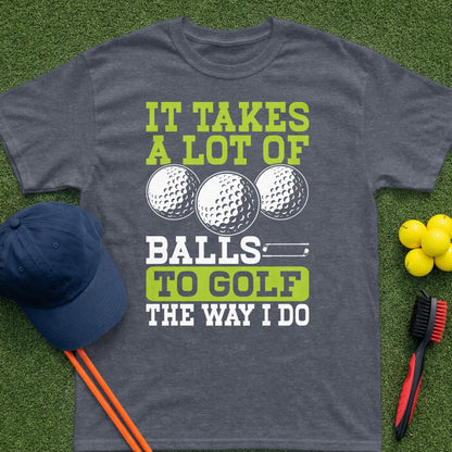Dark gray t-shirt with "It Takes A Lot Of Balls To Golf The Way I Do" text and golf balls.
