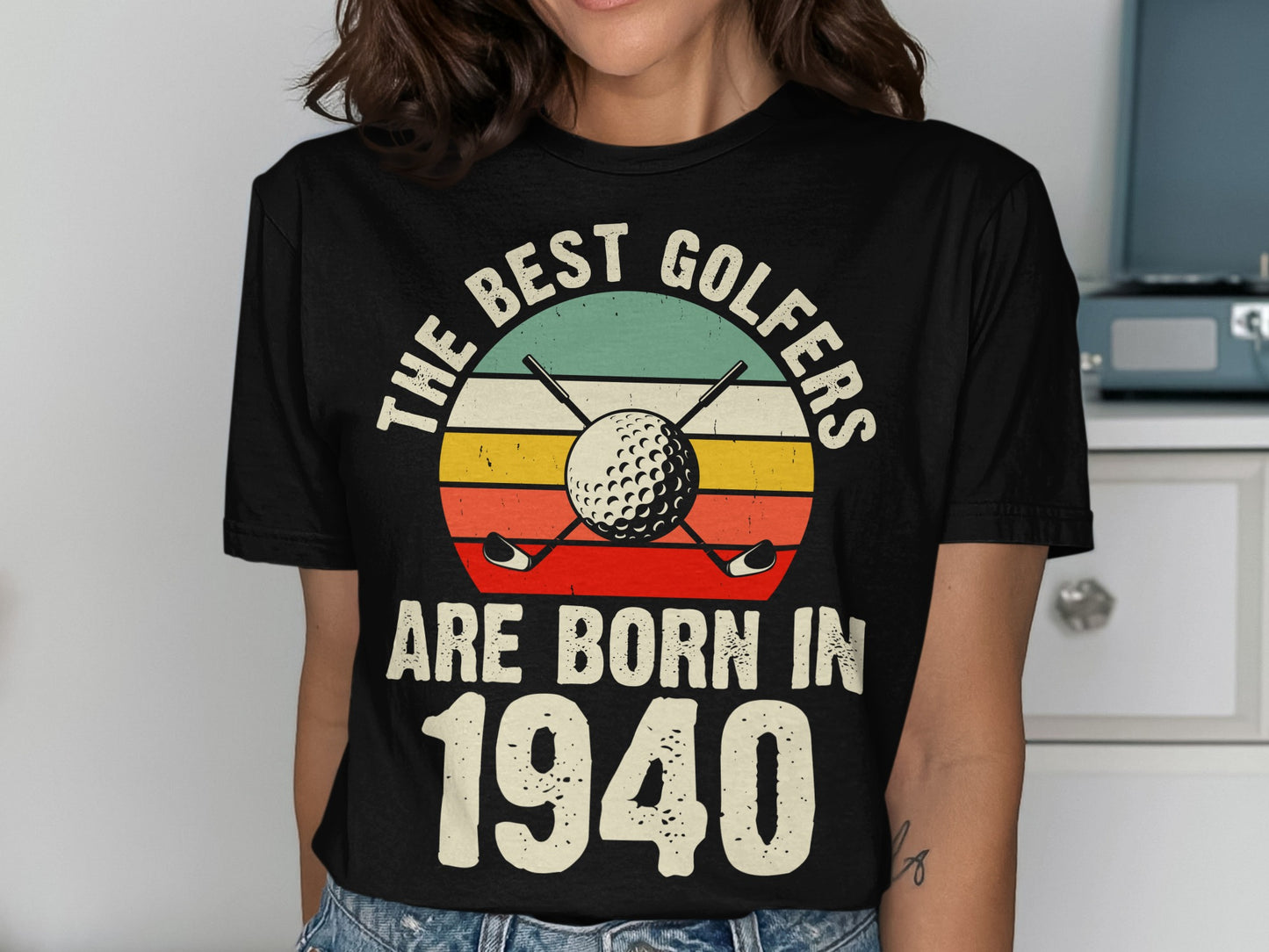 T-shirt with "The best golfers are born in 1940" and golf imagery.