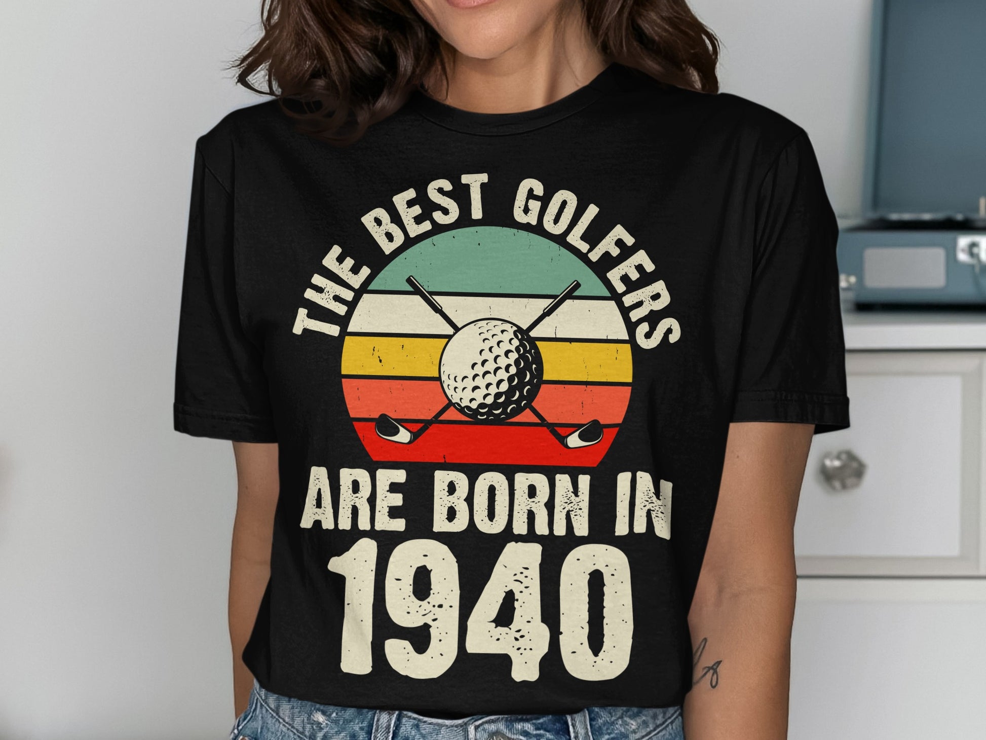 T-shirt with "The best golfers are born in 1940" and golf imagery.