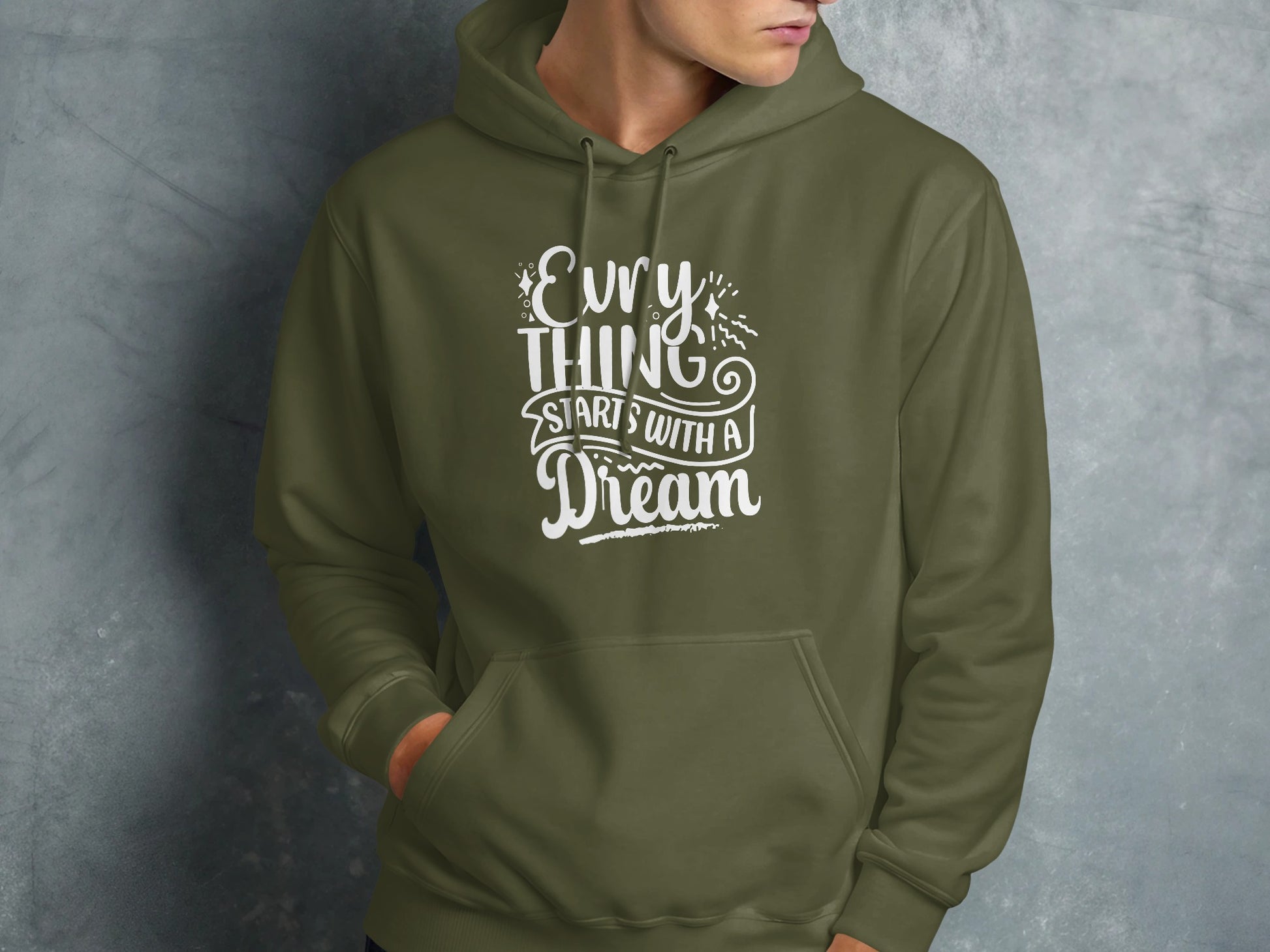 Olive hoodie with "Everything starts with a dream" white text.
