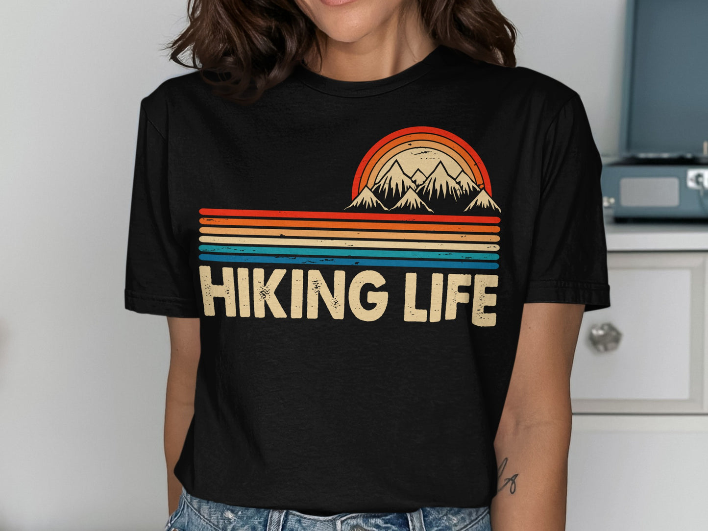Black t-shirt with "Hiking Life" text and mountain range graphic.