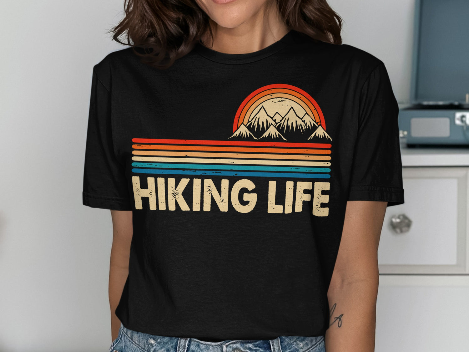 Black t-shirt with "Hiking Life" text and mountain range graphic.