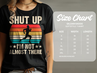 Black t-shirt with "Shut Up, I'm Not Almost There" and runner graphic.