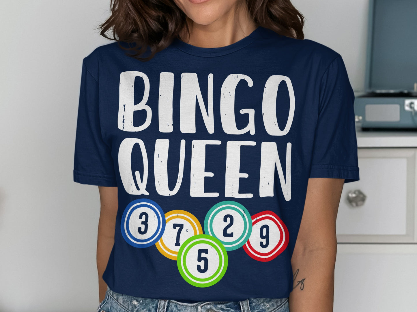Navy t-shirt with "BINGO QUEEN" text and colorful bingo balls.