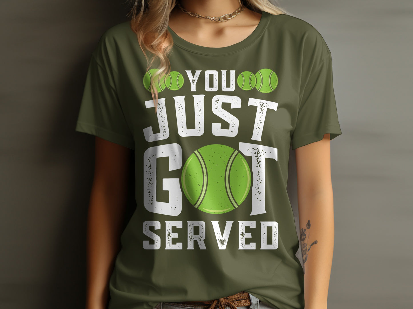 Green t-shirt with "YOU JUST GOT SERVED" and tennis ball graphic.