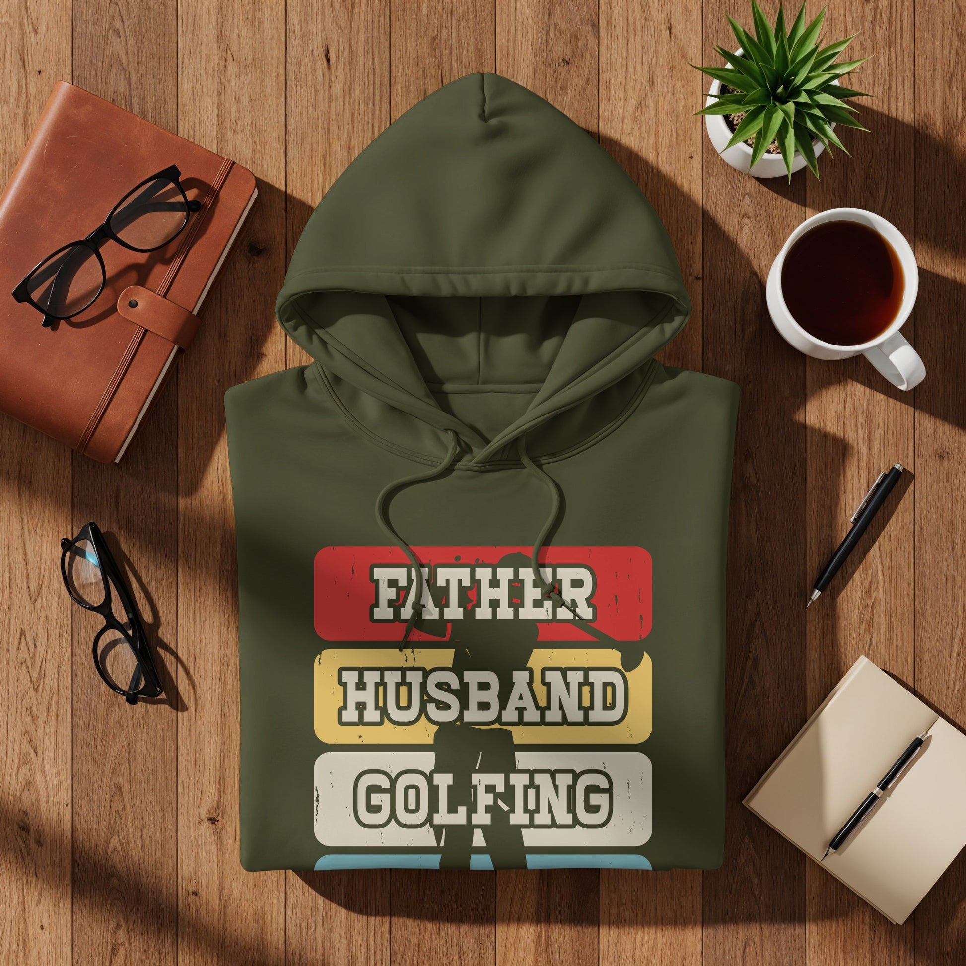Green hoodie with "Father Husband Golfing" text design.
