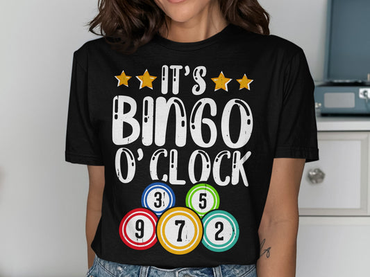 Black t-shirt with "IT'S BINGO O'CLOCK" and bingo balls.