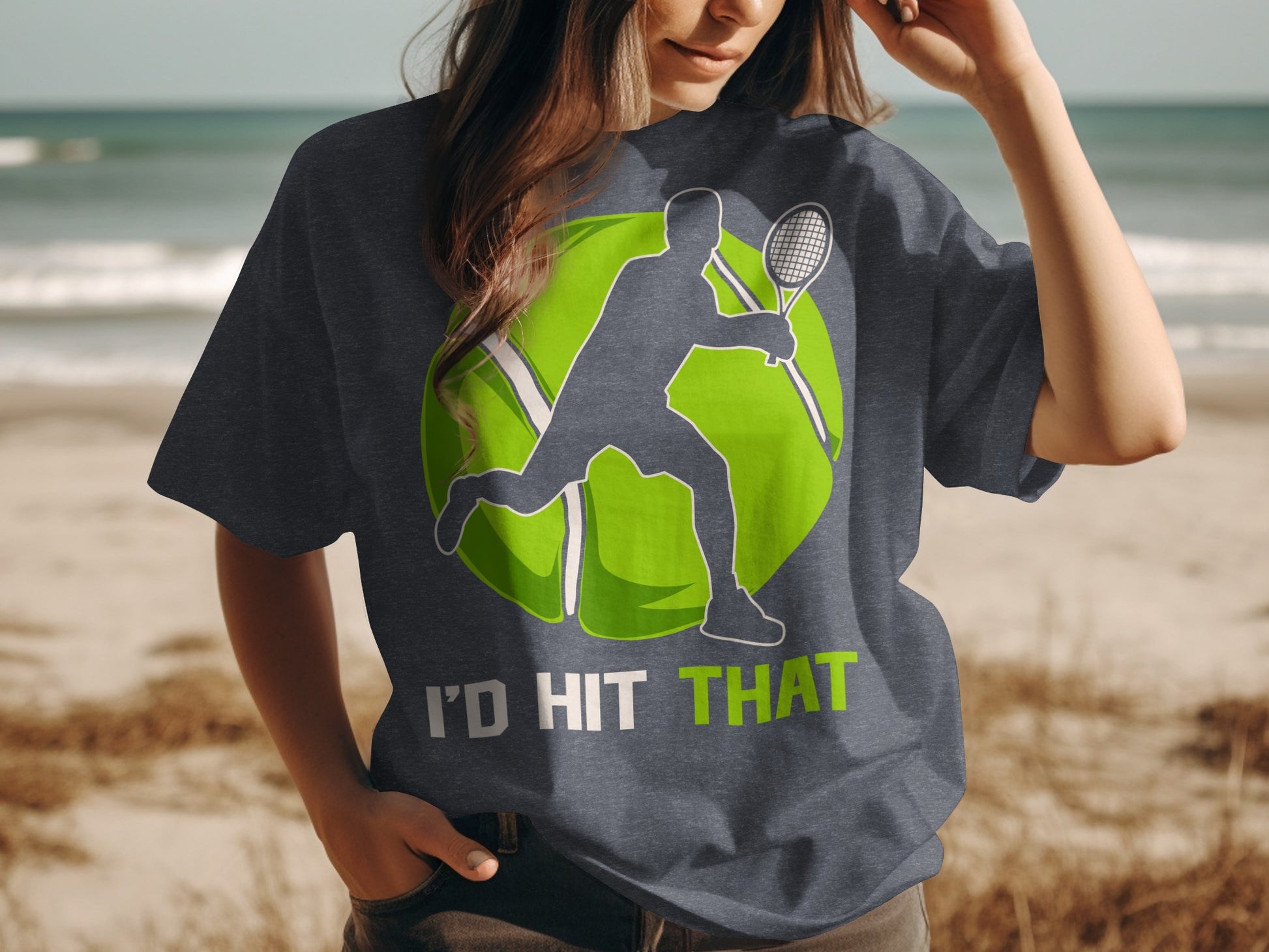 Dark t-shirt with graphic of tennis player mid-swing and text "I'D HIT THAT".