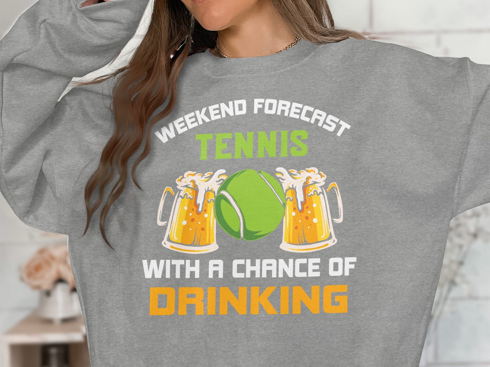 Sweatshirt with "Weekend forecast: tennis with a chance of drinking" and beer mugs.