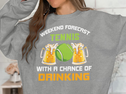 Sweatshirt with "Weekend forecast: tennis with a chance of drinking" and beer mugs.