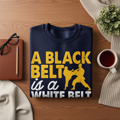 Navy sweatshirt with "A black belt is a white belt" text and martial arts graphics.