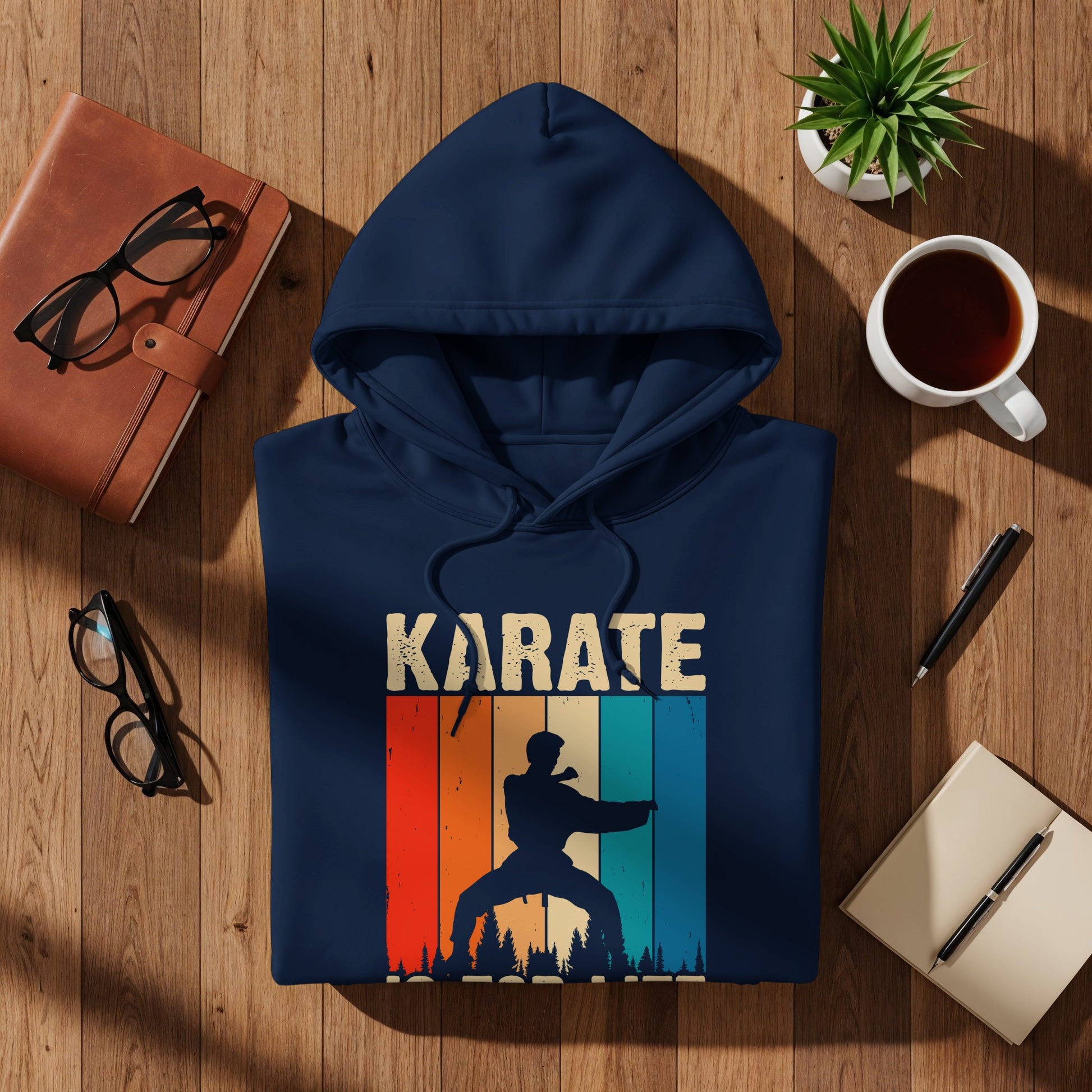 Navy hoodie with "KARATE" text and a vintage-style silhouette of a karate fighter.