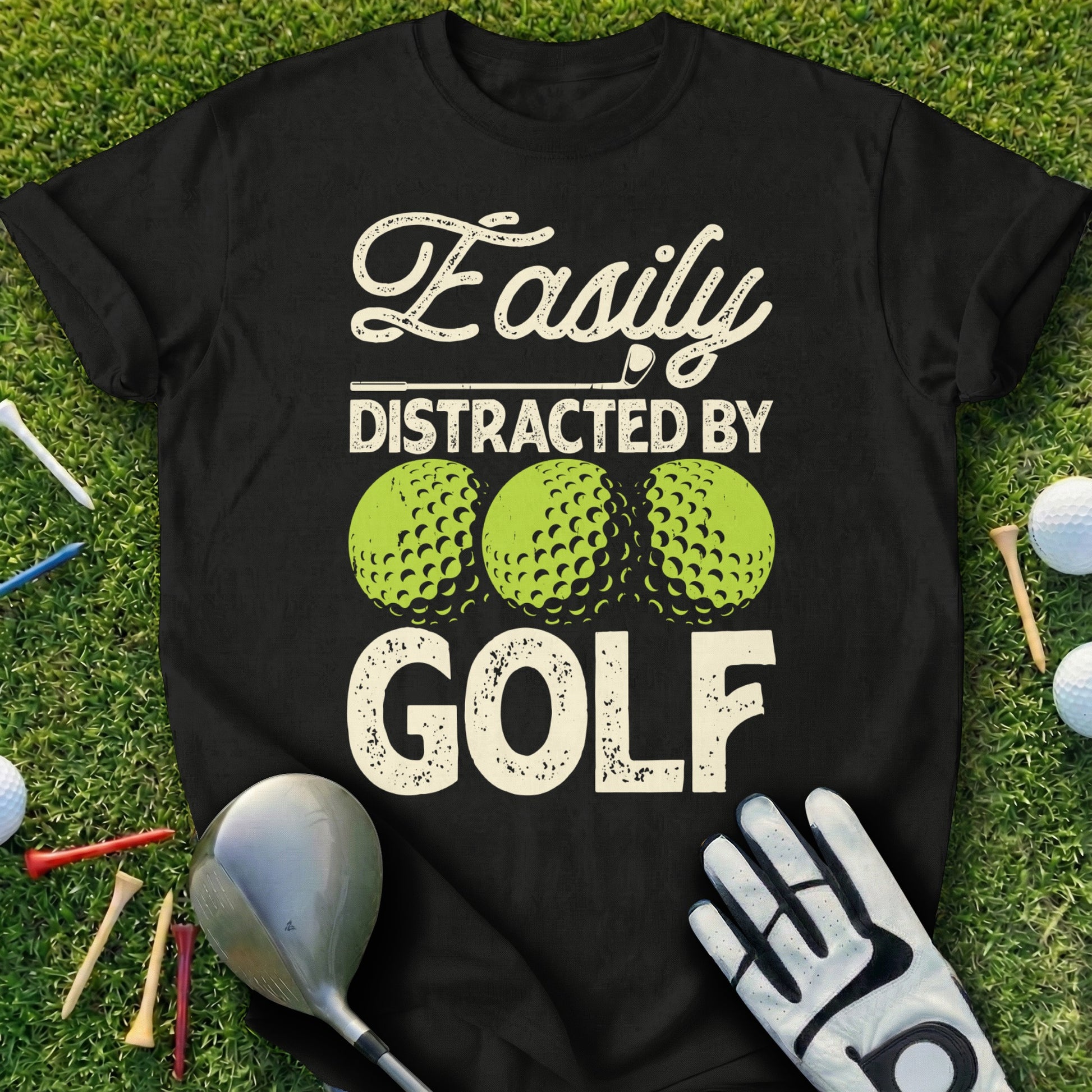 Black t-shirt with "Easily Distracted By GOLF" and three golf balls.