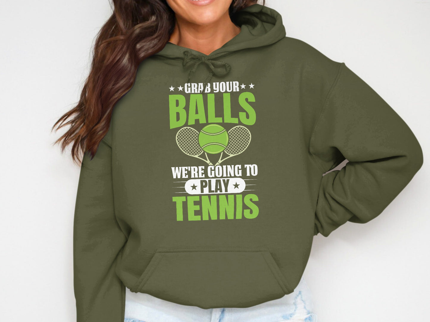 Green hoodie with text "GRAB YOUR BALLS WE'RE GOING TO PLAY TENNIS".
