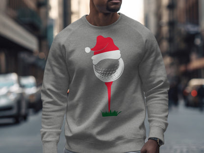Gray sweatshirt with a graphic of a golf ball wearing a Santa hat on a tee.