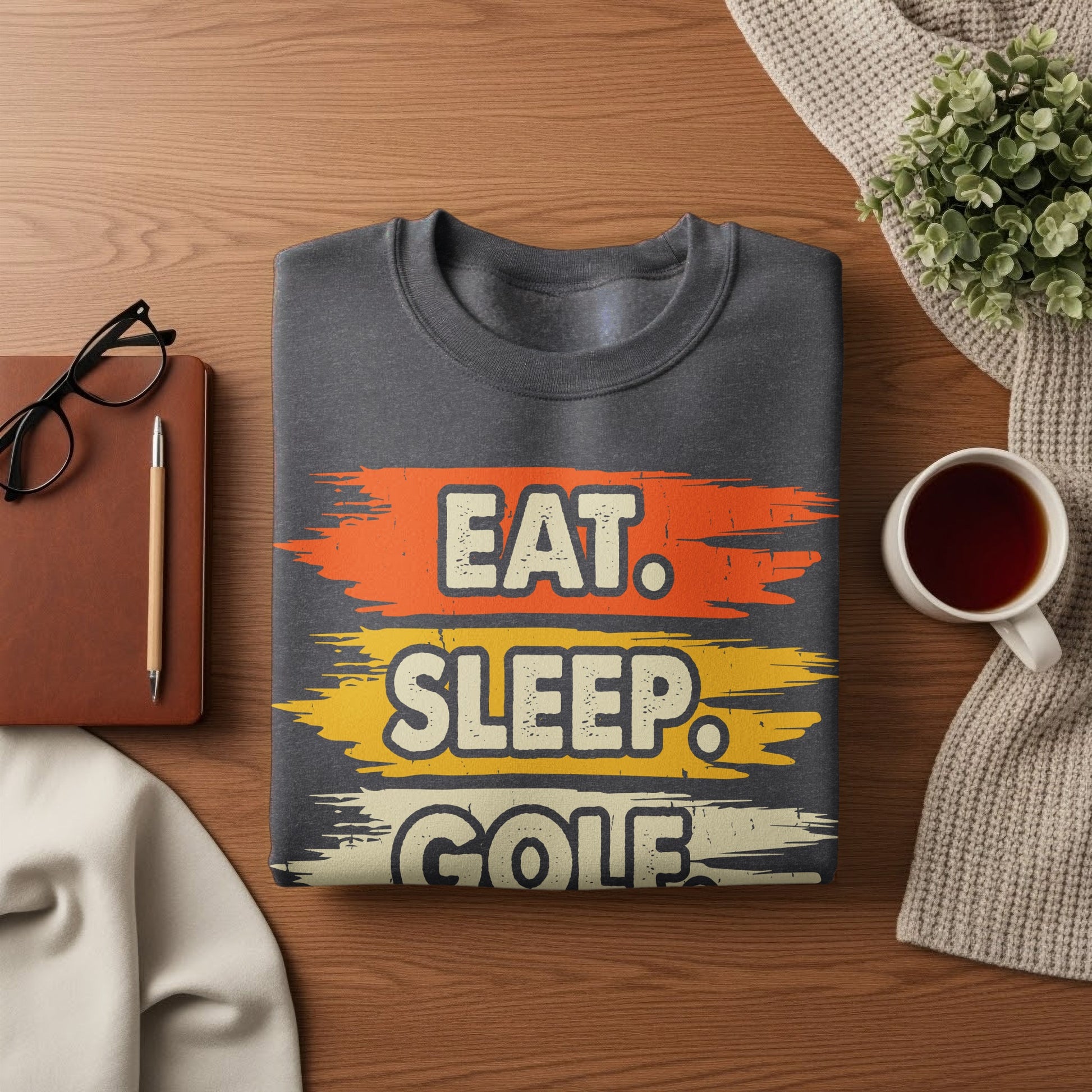 Dark gray sweatshirt with "Eat. Sleep. Golf." text in colorful stripes.