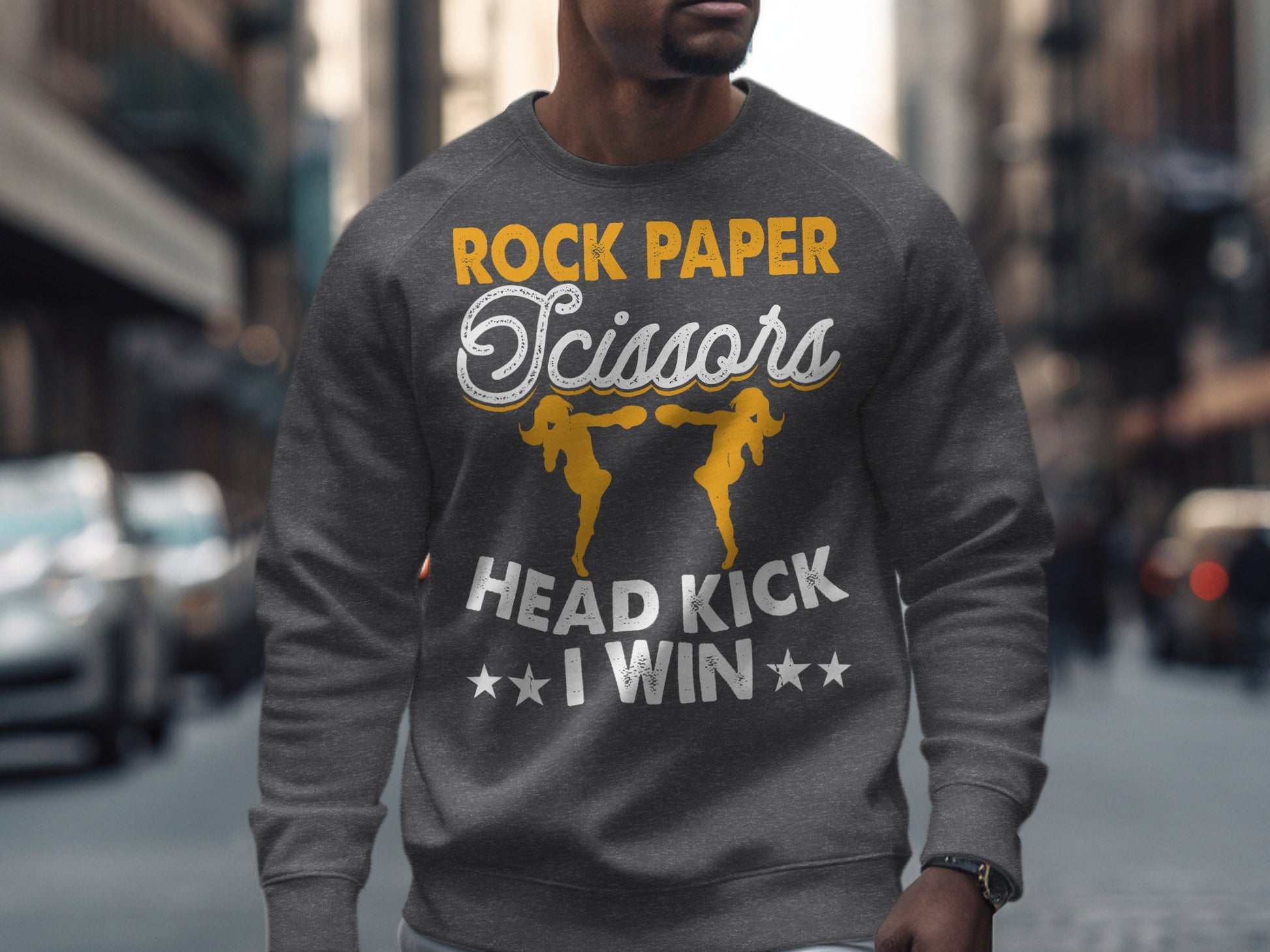 Grey sweatshirt with Rock Paper Scissors, Head Kick, I Win text and graphics.