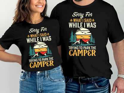 Black t-shirts with "Sorry For What I Said While Trying to Park the Camper" text and mountain graphic.