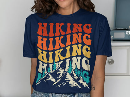 T-shirt with "Hiking" repeated in colorful retro font over mountains.