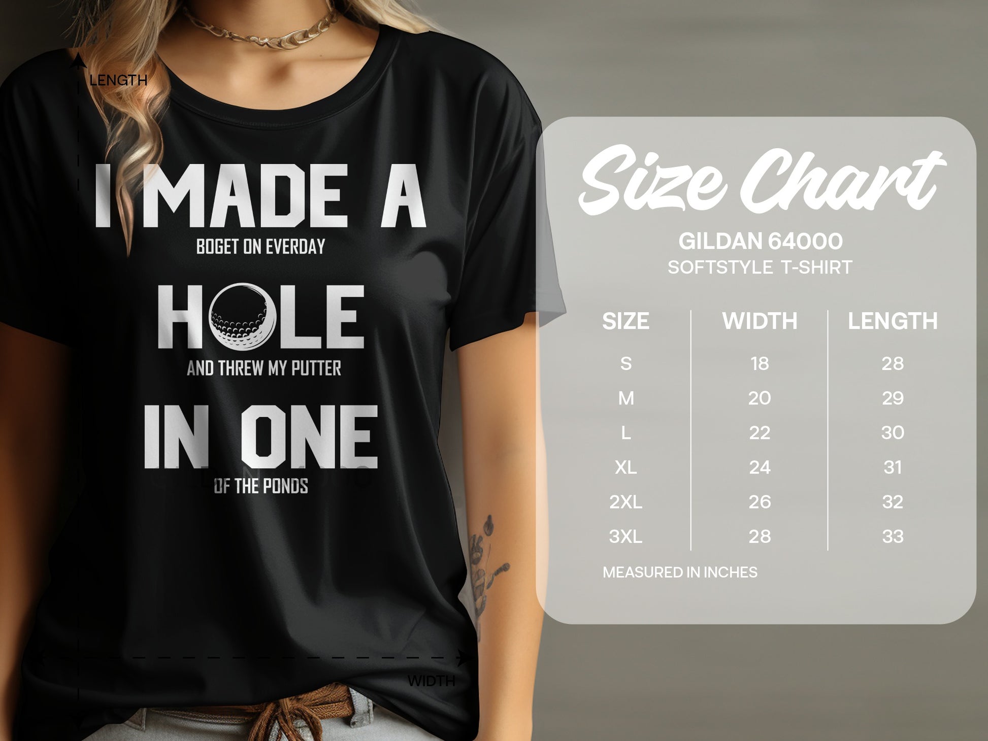 Black Gildan t-shirt with "I Made a Hole in One" text and golf ball graphic.