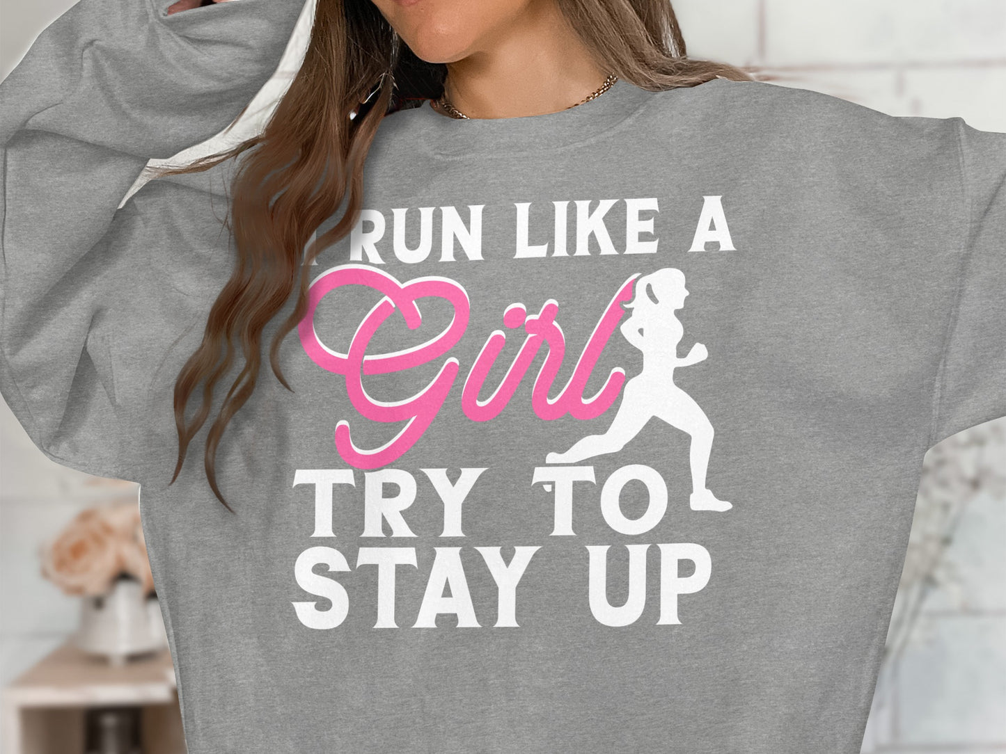 Gray sweatshirt with "Run like a Girl Try to Stay Up" graphic.