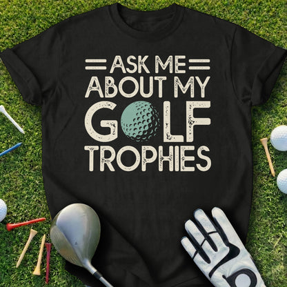 Black t-shirt with "Ask me about my golf trophies" and a golf ball.