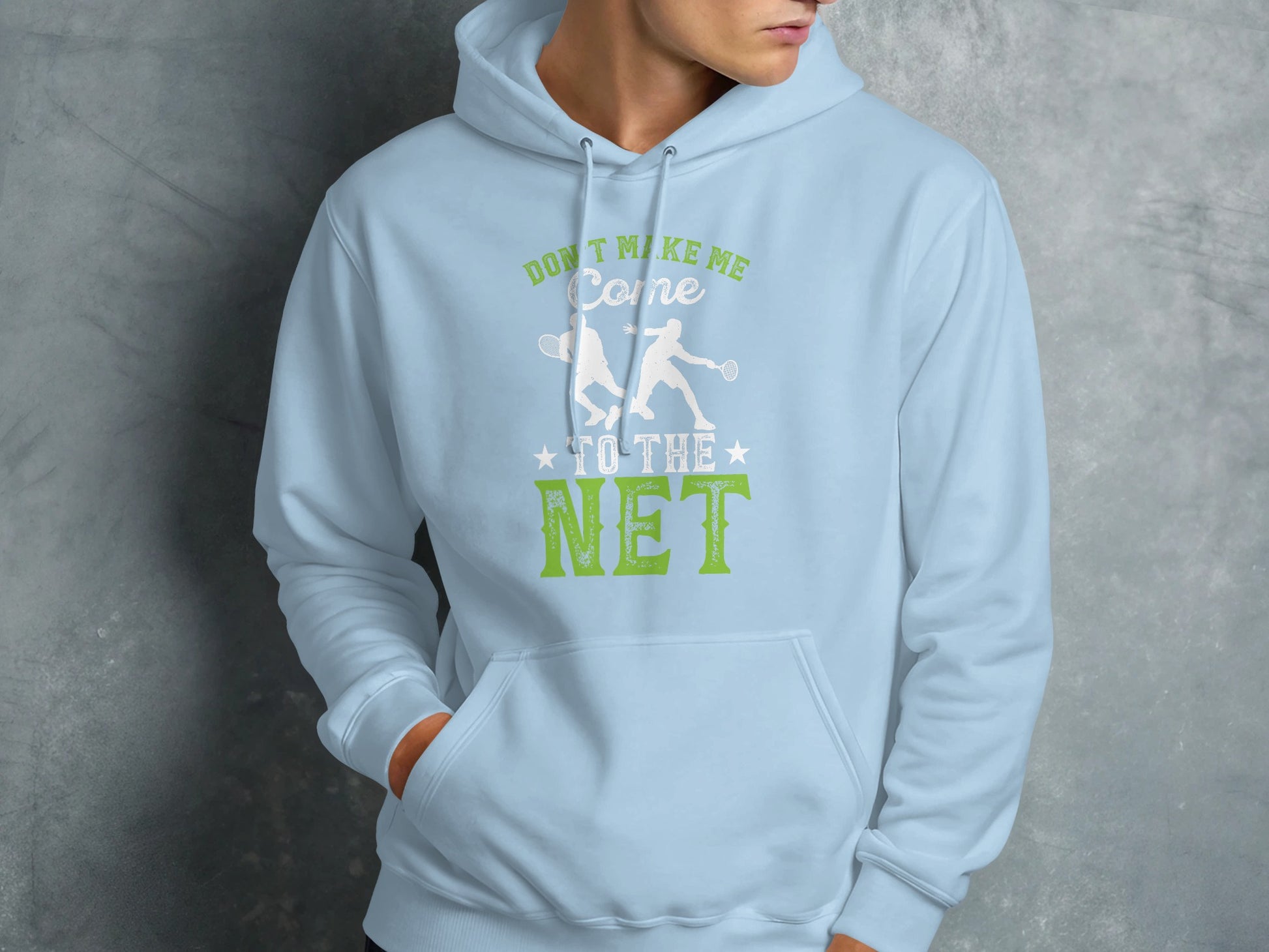 Light blue hoodie with "Don't Make Me Come to the Net" and tennis players graphic.