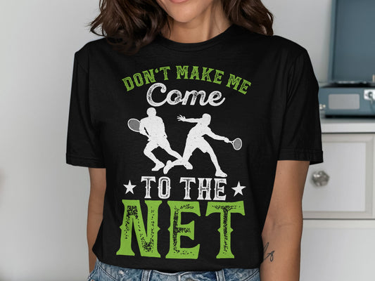 Black t-shirt with white and green text "Don't Make Me Come To The Net" and tennis player graphic.