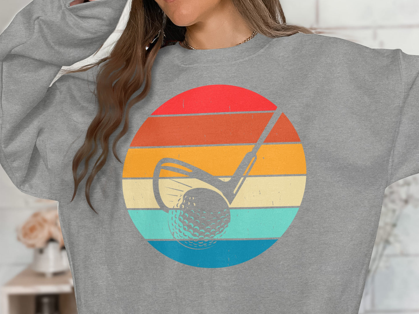 Retro golf ball and club graphic on striped sunset background.