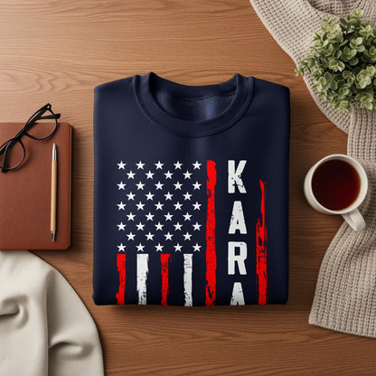 Navy sweatshirt with American flag design and "KARA" text.