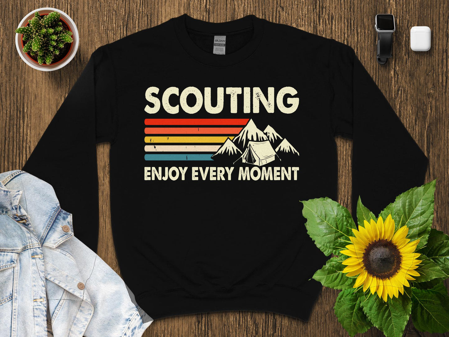 Sweatshirt with "SCOUTING ENJOY EVERY MOMENT" text and camping tent graphic.
