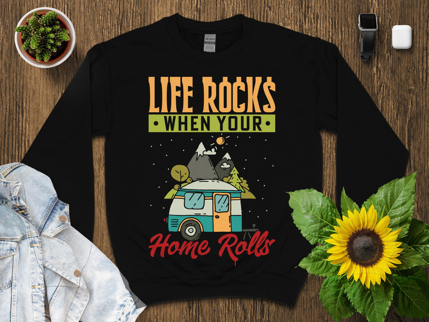 Black sweatshirt with "Life Rocks When Your Home Rolls" graphic and camper.