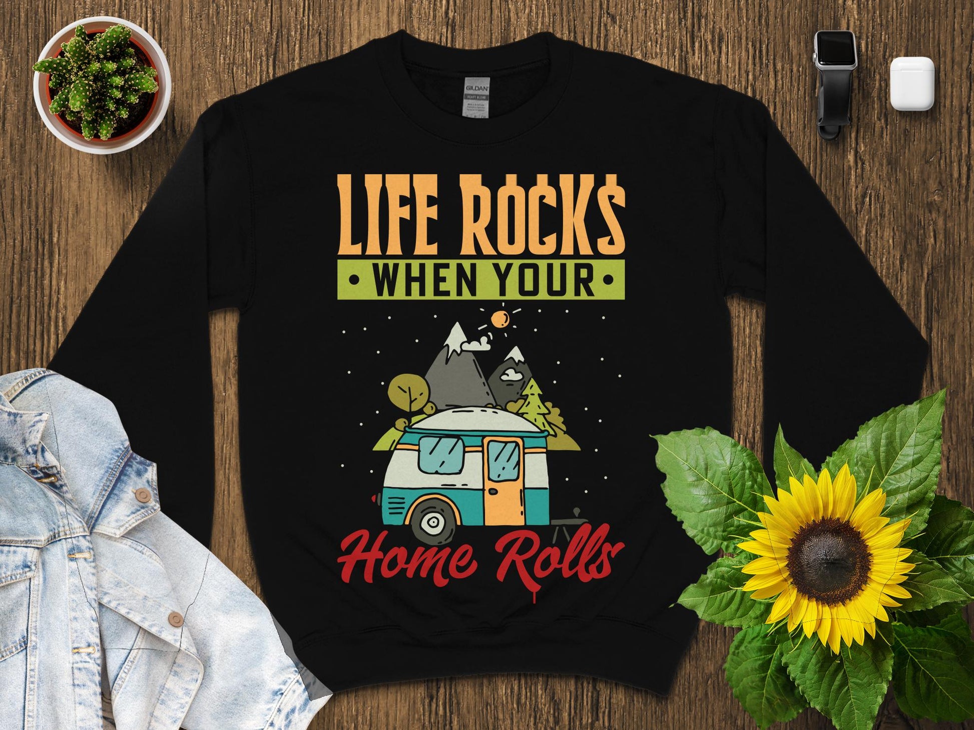Black sweatshirt with "Life Rocks When Your Home Rolls" graphic and camper.